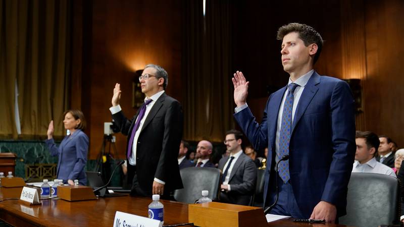 OpenAI chief execuitve Sam Altman, from right, NYU Professor Emeritus Gary Marcus and IBM chief privacy and trust officer Christina Montgomery are sworn in before testifying at a US Senate Judiciary Subcommittee on Privacy, Technology and the Law hearing on artificial intelligence, in May. AP