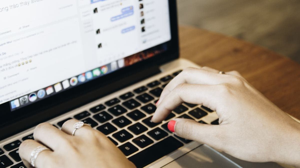 Woman typing on her laptop.